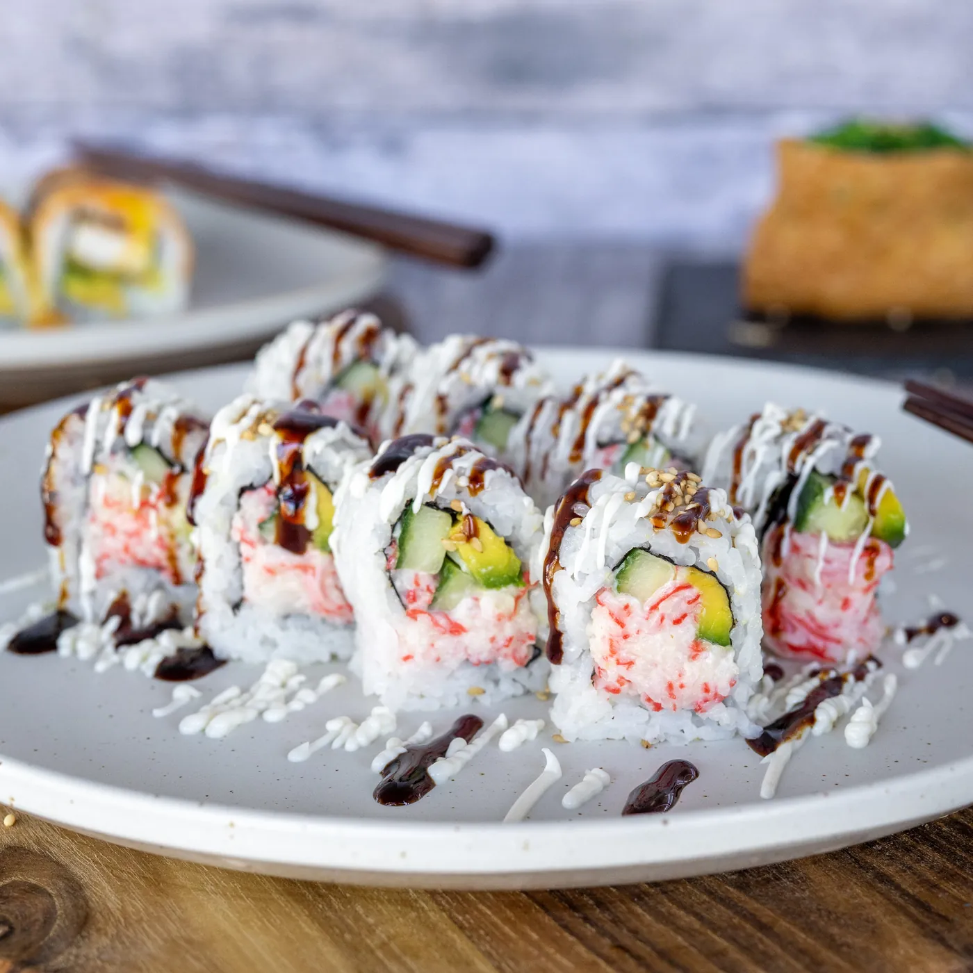 Sushi Ari signature sushi rolls, dressed and sliced to order